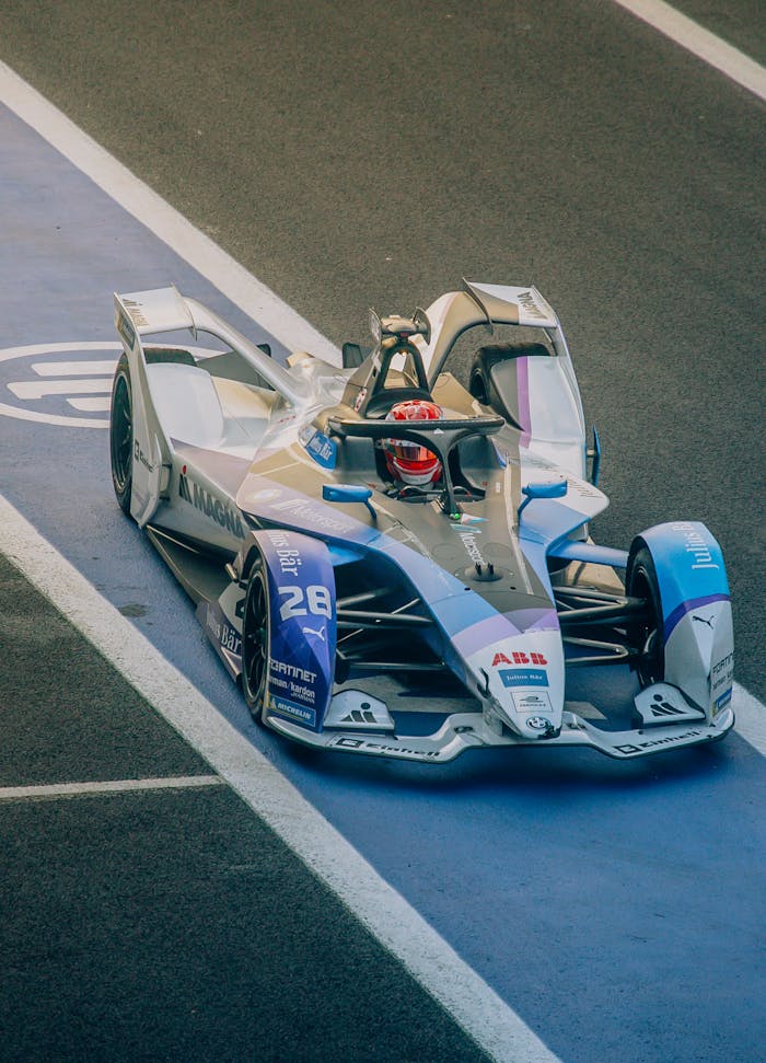 High-performance Formula E race car on a track in Mexico City, showcasing electric motorsport innovation.